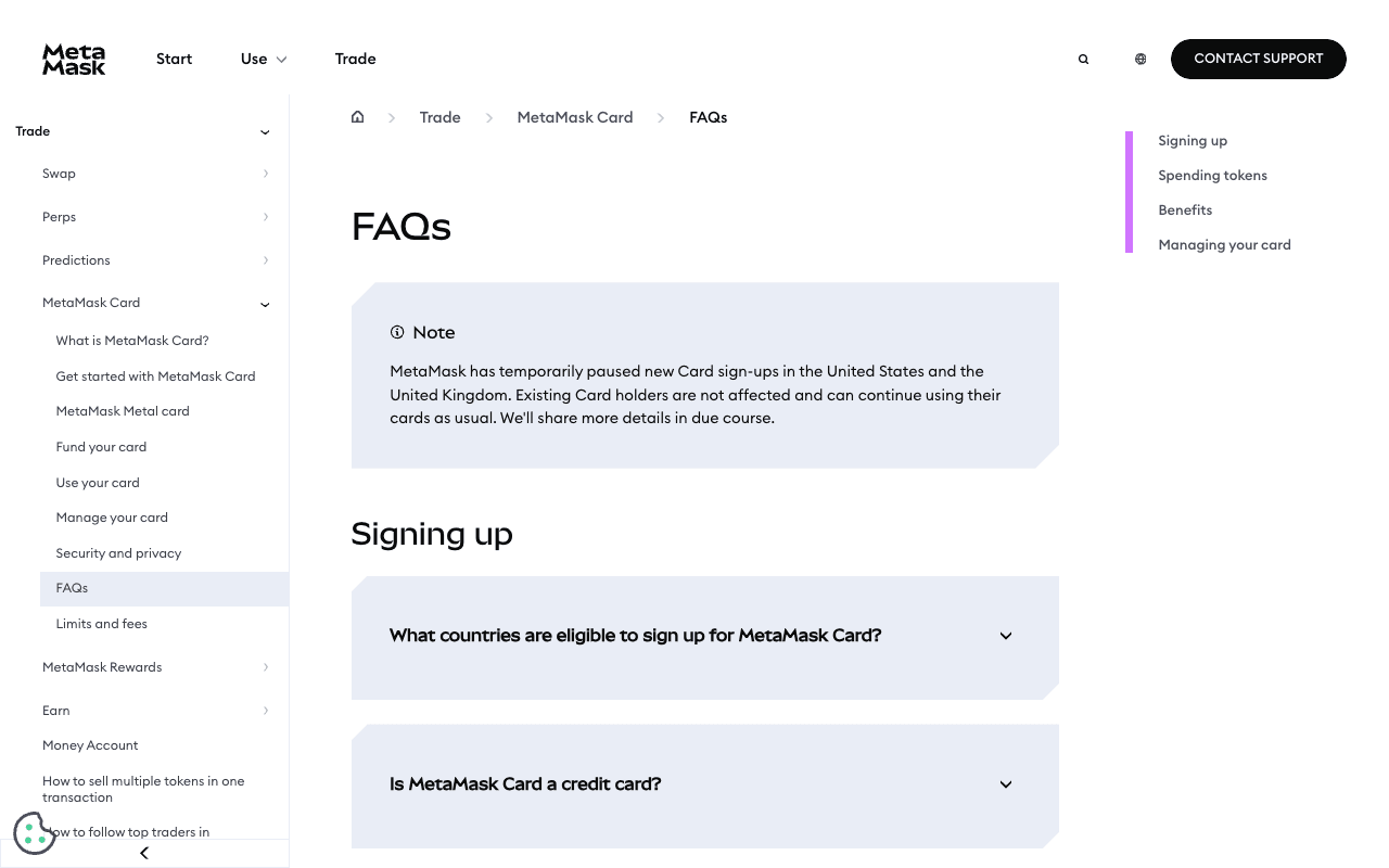 MetaMask Card FAQ help page with sections for signing up, spending tokens, benefits and managing your card, and a note that new US and UK card sign-ups are paused